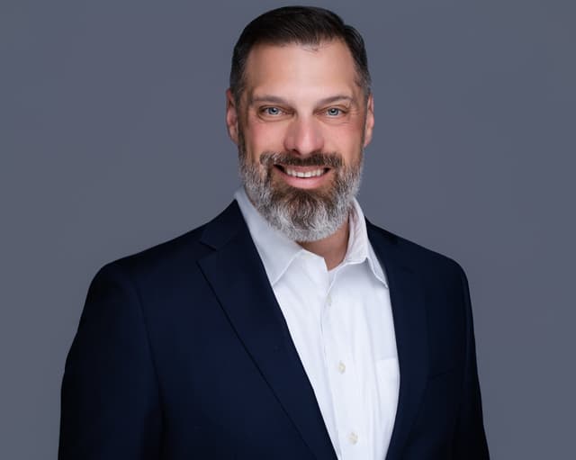 Business headshot in navy suit - professional styling example