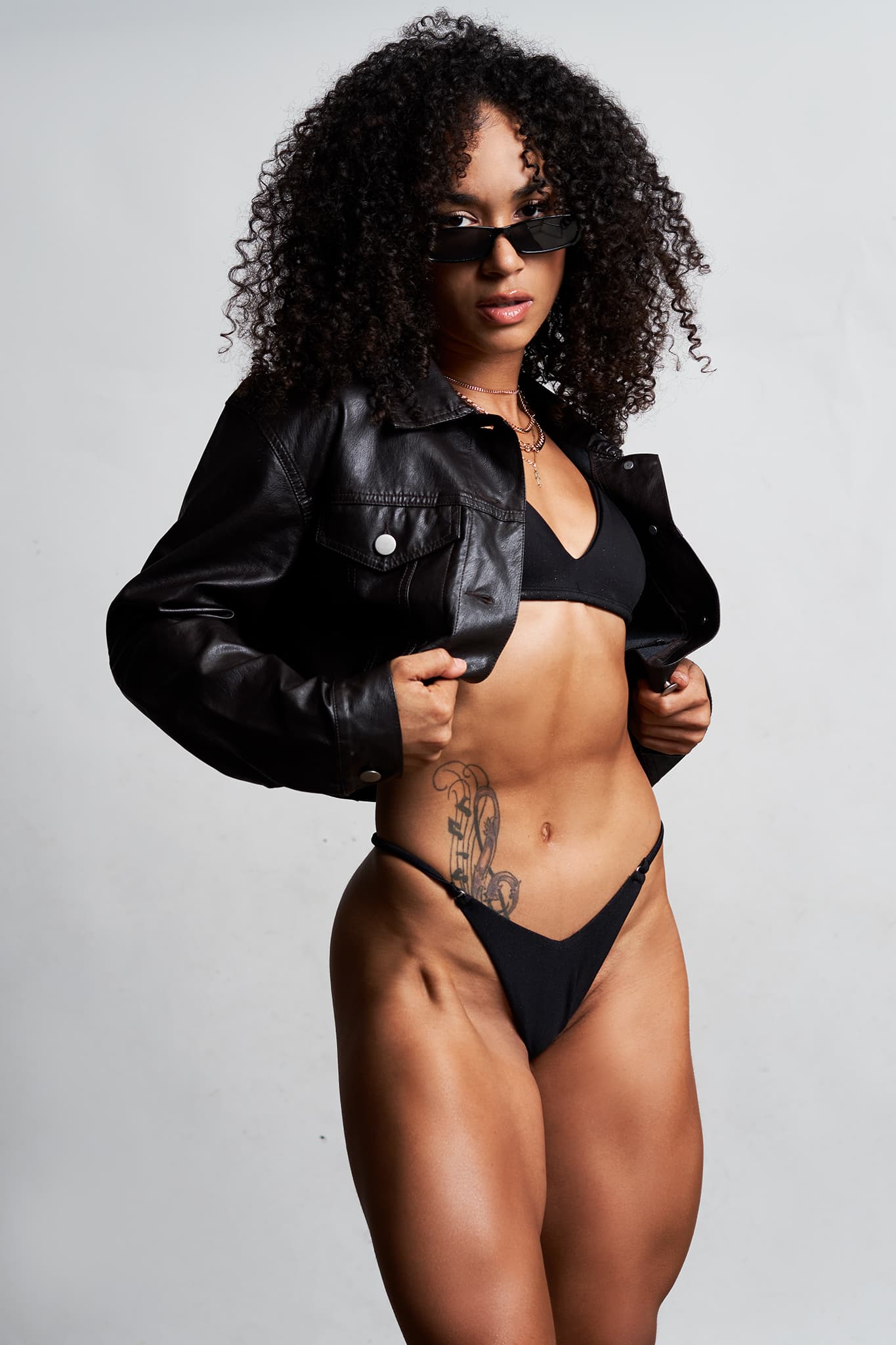 Kaylana fitness model with dramatic side lighting - studio session